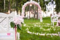 Wedding benches and flower arch for ceremony
