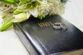 Wedding Bible Rings and Flowers Royalty Free Stock Photo