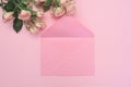 Wedding or birthday mock up scene. Blank open envelope with place for text for spring greeting card. Bouquet of pink