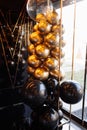 Wedding or birthday photo zone with white, black and gold balloons indoors. Holiday party decoration. Colorful balloons background