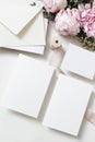 Wedding, birthday stationery mock-up scene. Blank greeting cards, invitations. Decorative floral composition. Closeup of