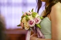 A wedding bouquet being held by a bridesmaid Royalty Free Stock Photo