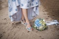 wedding bouquet, blue flowers on the background of the road, bride with flowers Royalty Free Stock Photo