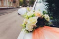 Wedding bouquet bridal decoration on luxury white car. Royalty Free Stock Photo