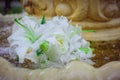 The Wedding Bridal Bouquet Of White Roses Lies In An Old Fountain Under Splashes And Drops Of Water. Royalty Free Stock Photo