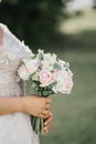 Wedding details of the bride close-up. Bouquet of different flowers.