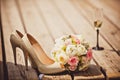 Wedding bouquet and bride shoes