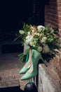 Wedding bouquet for the bride of white and pink flowers and shoes Royalty Free Stock Photo