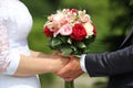 Wedding bouquet in brides and grooms hands Royalty Free Stock Photo