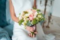 Wedding bouquet and bridesmaid shoes on blue mat Royalty Free Stock Photo