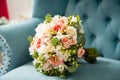 Wedding bouquet and bridesmaid shoes on blue mat Royalty Free Stock Photo