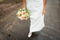 Wedding bouquet and bridesmaid shoes on blue mat Royalty Free Stock Photo