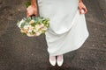 Wedding bouquet and bridesmaid shoes on blue mat Royalty Free Stock Photo