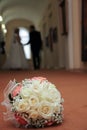 Wedding bouquet bright beige colors and the bride and groom for a walk in the Museum Royalty Free Stock Photo