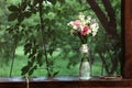 Wedding bouquet of carnations and roses, standing in cans. Royalty Free Stock Photo