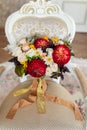 Wedding bouquet of chrysanthemum bride lies on the armchair