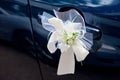 Wedding bouquet decoration on the door handle of a wedding procession car Royalty Free Stock Photo