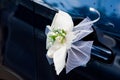 Wedding bouquet decoration on the door handle of a wedding procession car Royalty Free Stock Photo