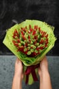 Wedding bouquet of dried flowers of red and green. Beautiful colorful decor