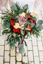 Beautiful wedding bouquet in hands of the bride