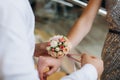 Decoration of rose flowers on the hand of the girlfriend of the bride