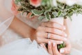 Wedding bouquet of flowers in brides` hands