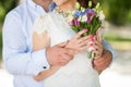 Wedding bouquet of flowers in hands of beautiful anonymous young Royalty Free Stock Photo