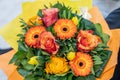 Wedding bouquet of flowers held by bride closeup. orange roses and flowers Royalty Free Stock Photo