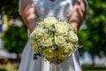 Wedding bouquet of flowers held by bride closeup. yellow roses flower Royalty Free Stock Photo