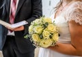 Wedding bouquet of flowers held by bride closeup. yellow roses flower Royalty Free Stock Photo