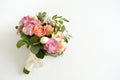 Wedding bouquet with flowers roses on a white background with copy space. minimal concept. mockup Royalty Free Stock Photo