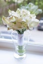 Wedding bouquet of flowers. White Calla lilies. The bouquet is in a glass vase Royalty Free Stock Photo