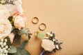 Wedding bouquet and gold rings, closeup Royalty Free Stock Photo