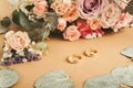 Wedding bouquet and gold rings, closeup Royalty Free Stock Photo