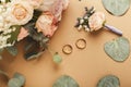 Wedding bouquet and gold rings, closeup Royalty Free Stock Photo