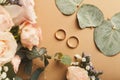 Wedding bouquet and gold rings, closeup Royalty Free Stock Photo