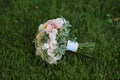 Wedding bouquet on green grass. Bride's flowers Royalty Free Stock Photo