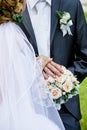 Wedding bouquet and groom