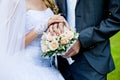 Wedding bouquet and groom