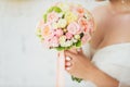 Wedding bouquet in hands of the bride. Royalty Free Stock Photo