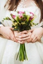 Wedding bouquet in hands of bride Royalty Free Stock Photo