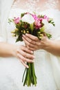 Wedding bouquet in hands of bride Royalty Free Stock Photo