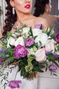 Wedding bouquet in hands of the bride