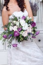 Wedding bouquet in hands of the bride