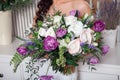 Wedding bouquet in hands of the bride