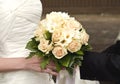 Wedding bouquet in hands of the bride and groom Royalty Free Stock Photo