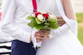 Wedding bouquet in the hands of bride and groom Royalty Free Stock Photo