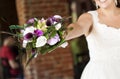 Wedding bouquet in hands of the bride Royalty Free Stock Photo