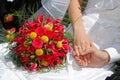 Wedding bouquet with hands with rings Royalty Free Stock Photo