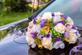 Wedding bouquet on the hood of a white retro car Royalty Free Stock Photo